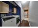 Functional laundry room with washer, dryer, and storage cabinets at 6930 Summer Harbor Ln, Riverview, FL 33578