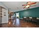 Spacious living room features hardwood floors and an open floor plan connecting to the kitchen at 6930 Summer Harbor Ln, Riverview, FL 33578