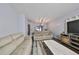 Inviting living room with comfortable seating, modern decor, and stylish flooring at 6930 Summer Harbor Ln, Riverview, FL 33578