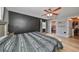 Spacious main bedroom features a walk-in closet, ensuite bathroom, and a large black accent wall at 6930 Summer Harbor Ln, Riverview, FL 33578