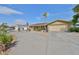 Spacious circular driveway in front of a charming home with well-maintained landscaping and an attached garage at 727 Flamingo Dr, Apollo Beach, FL 33572