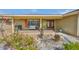 Charming home featuring a welcoming front porch, a double door entry and colorful landscaping for instant curb appeal at 727 Flamingo Dr, Apollo Beach, FL 33572