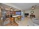 Open kitchen and living area with breakfast bar and sliding glass doors leading to the pool area at 727 Flamingo Dr, Apollo Beach, FL 33572