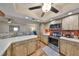 Well-equipped kitchen with stainless appliances, white countertops, and wood-look cabinets at 727 Flamingo Dr, Apollo Beach, FL 33572