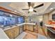 Bright kitchen offering breakfast bar, stainless steel appliances, and hardwood floors at 727 Flamingo Dr, Apollo Beach, FL 33572