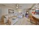 Comfortable living room with neutral colors, plush sectional sofa, and tile flooring at 727 Flamingo Dr, Apollo Beach, FL 33572