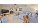 Spacious living room with tile flooring, large sectional sofa, and stylish decor at 727 Flamingo Dr, Apollo Beach, FL 33572