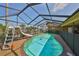 Enclosed pool with a slide and partial water views at 727 Flamingo Dr, Apollo Beach, FL 33572