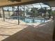A screened-in lanai with a private pool overlooking the canal at 727 Flamingo Dr, Apollo Beach, FL 33572