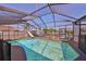 Enclosed pool with a slide and water views at 727 Flamingo Dr, Apollo Beach, FL 33572