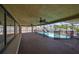 Covered patio overlooking the fenced pool with a canal view at 727 Flamingo Dr, Apollo Beach, FL 33572