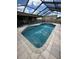 Screened-in pool features ample natural light and easy access to the home interior at 727 Flamingo Dr, Apollo Beach, FL 33572