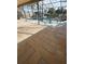 A beautiful screened-in pool overlooks the waterfront on a sunny day at 727 Flamingo Dr, Apollo Beach, FL 33572