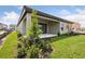 Well-manicured backyard with patio, landscaping and lush green grass at 8521 Dove Bog Ter, Parrish, FL 34219