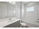 Bathroom with a modern sink and vanity complemented by a bathtub and shower combination at 8521 Dove Bog Ter, Parrish, FL 34219
