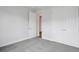 Spacious bedroom featuring soft gray carpet, neutral walls, and ample closet space at 8521 Dove Bog Ter, Parrish, FL 34219