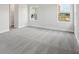 Spacious bedroom with neutral carpet and walls and featuring two windows for plenty of light at 8521 Dove Bog Ter, Parrish, FL 34219