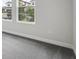 Comfortable bedroom featuring plush gray carpeting and natural light streaming through the windows at 8521 Dove Bog Ter, Parrish, FL 34219