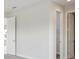 Bedroom features neutral carpet and walls, with two doorways and windows bringing in natural light at 8521 Dove Bog Ter, Parrish, FL 34219