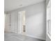 Bedroom with gray carpet, white walls, and a glimpse of an adjoining bathroom through an open doorway at 8521 Dove Bog Ter, Parrish, FL 34219