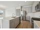 Well-equipped kitchen featuring stainless steel appliances and quartz countertops at 8521 Dove Bog Ter, Parrish, FL 34219