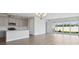 Open-concept kitchen and living area with modern finishes and ample natural light at 8521 Dove Bog Ter, Parrish, FL 34219