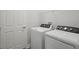 Well-equipped laundry room with modern appliances and a clean, functional space at 8521 Dove Bog Ter, Parrish, FL 34219