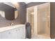 Contemporary bathroom featuring a modern vanity, and a glass-door shower at 10084 Twelve Oaks Ct, Weeki Wachee, FL 34613