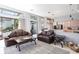 Inviting living room showcasing comfortable seating and an open layout to the kitchen at 10084 Twelve Oaks Ct, Weeki Wachee, FL 34613