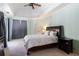 Serene bedroom with tray ceilings, soft lighting, and ensuite bathroom access at 10084 Twelve Oaks Ct, Weeki Wachee, FL 34613