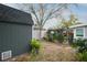 Backyard featuring a shed, pergola, and plantings at 1016 Greenleaf Way, Tarpon Springs, FL 34689