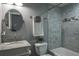 Updated bathroom featuring modern fixtures, marble tile, and stylish decor at 1016 Greenleaf Way, Tarpon Springs, FL 34689