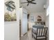 Bright bedroom with a bed, chair, and artwork at 1016 Greenleaf Way, Tarpon Springs, FL 34689
