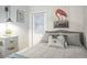 Charming bedroom with flamingo art, comfortable bed, and stylish decor at 1016 Greenleaf Way, Tarpon Springs, FL 34689