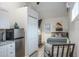 Bedroom with small fridge, TV, and comfortable bed at 1016 Greenleaf Way, Tarpon Springs, FL 34689