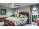 Spacious main bedroom featuring a ceiling fan and large windows at 1016 Greenleaf Way, Tarpon Springs, FL 34689