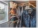 Wooden closet with shelves and hanging clothes at 1016 Greenleaf Way, Tarpon Springs, FL 34689