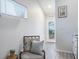 Inviting entrance area with comfortable seating and natural light at 1016 Greenleaf Way, Tarpon Springs, FL 34689