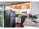 Well-lit kitchen with granite countertops and stainless steel appliances at 1016 Greenleaf Way, Tarpon Springs, FL 34689