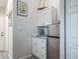 Compact kitchenette area with white cabinetry and a mini-fridge at 1016 Greenleaf Way, Tarpon Springs, FL 34689