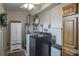 Well-organized laundry room with cabinets, modern washer, and dryer at 1016 Greenleaf Way, Tarpon Springs, FL 34689