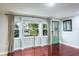 Bright living room with hardwood floors and a decorative door at 1016 Greenleaf Way, Tarpon Springs, FL 34689