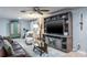 Inviting living room featuring built-in shelving for a TV and ceiling fan at 1016 Greenleaf Way, Tarpon Springs, FL 34689