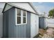 Backyard sheds feature corrugated metal and frame construction at 1016 Greenleaf Way, Tarpon Springs, FL 34689