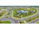 Aerial view highlighting the community clubhouse, pool, and thoughtfully designed roadways amidst a neighborhood setting at 10741 Charlotte Dr, Parrish, FL 34219