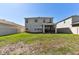 Backyard featuring a lawn and a screened in patio at 10741 Charlotte Dr, Parrish, FL 34219