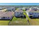 Aerial view of a fenced backyard with green grass and an outdoor screened in lanai space at 10741 Charlotte Dr, Parrish, FL 34219