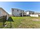 Backyard featuring a lawn and a screened in patio at 10741 Charlotte Dr, Parrish, FL 34219