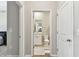 Bright bathroom featuring a single sink vanity with white cabinets and a standard toilet at 10741 Charlotte Dr, Parrish, FL 34219