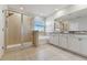 Bright bathroom featuring a glass shower, soaking tub, and double sink vanity at 10741 Charlotte Dr, Parrish, FL 34219